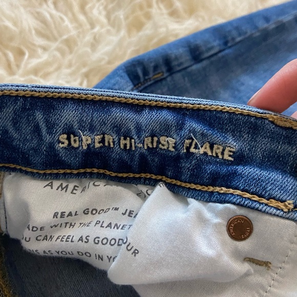 American Eagle Super Hi-Rise Flare Medium Wash Distressed Jeans, size 12 - Picture 7 of 11